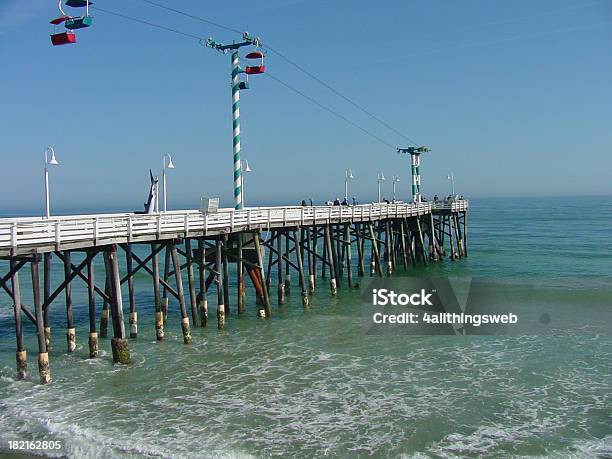 Fishing Pier On The Ocean Stock Photo - Download Image Now - Beach, Daytona Beach, Water's Edge