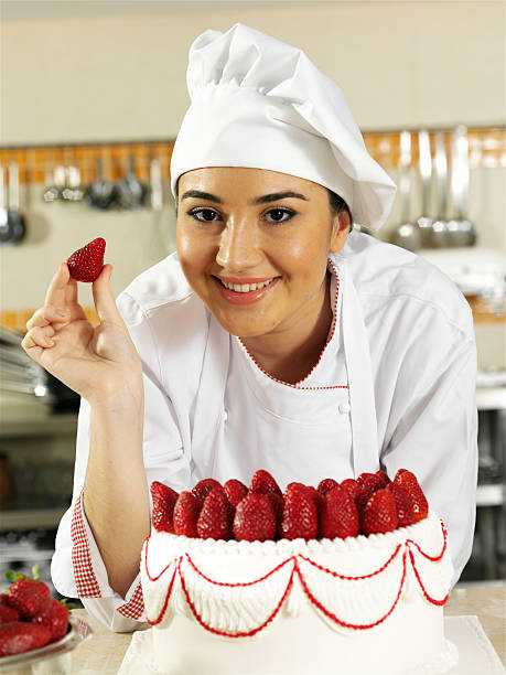 istock Female chef holding strawberry 182163557