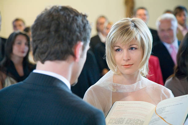 istock wedding ceremony bride and groom in church 182163559