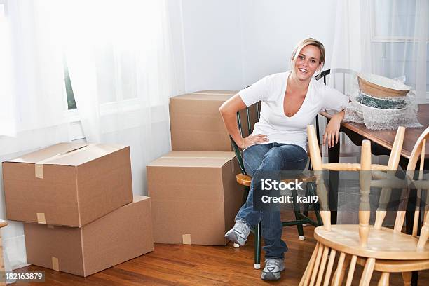 Young Woman Moving Into New Home Stock Photo - Download Image Now - 20-24 Years, 20-29 Years, Adult