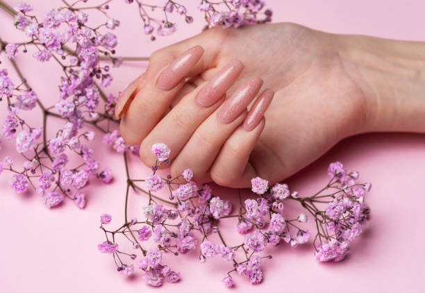 istock Female hands with beautiful manicure on pink background 1821646444
