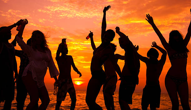 istock Young people having a beach party at sunset 182164772