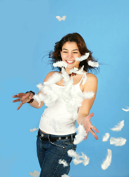 istock Young woman with feathers 182165258