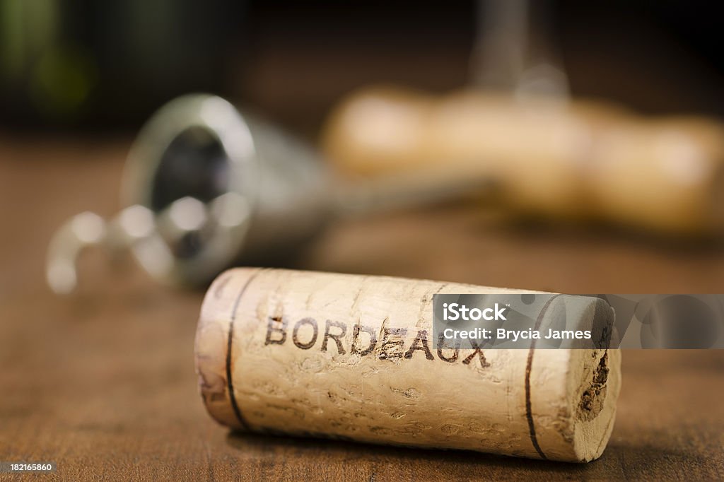 Wine Cork from Bordeaux France Horizontal "A wine cork from Bordeaux France with a corkscrew, wine glass, and wine bottle in the background." Bordeaux Stock Photo
