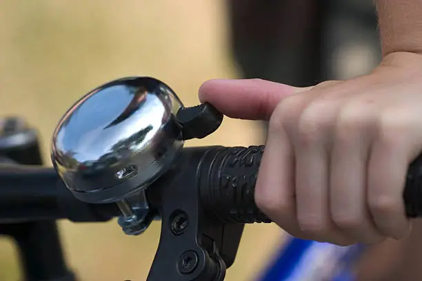 Close up of bicycle bell on handlebars. Nice narrow depth of field. We have another bicycle bell image as well as a series of boys on bikes in our portfolio.