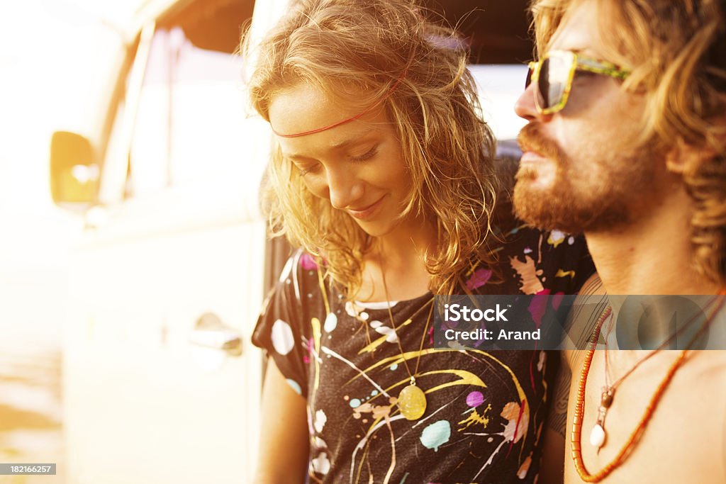 young couple on a beach young couple having fun with retro car on a beach Adult Stock Photo