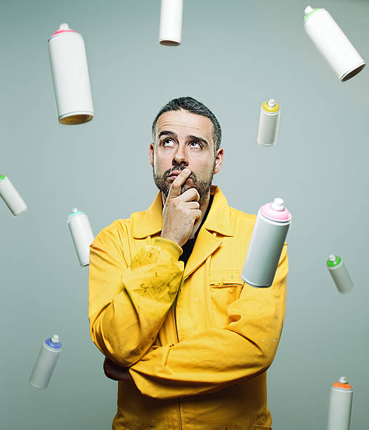 Street artist with floating cans