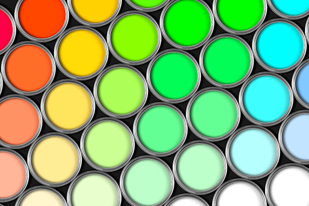 istock Rows of multicoloured open tins of paint on black 182166458