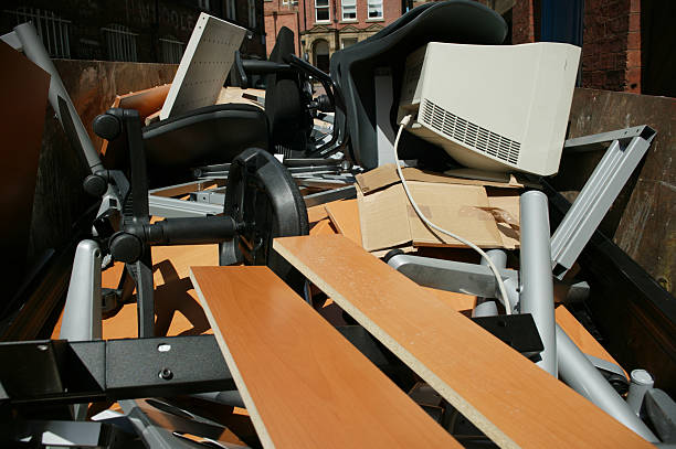 office waste Skip from office clearout with outrageous wasted furniture and PC equipment obsolescence stock pictures, royalty-free photos & images
