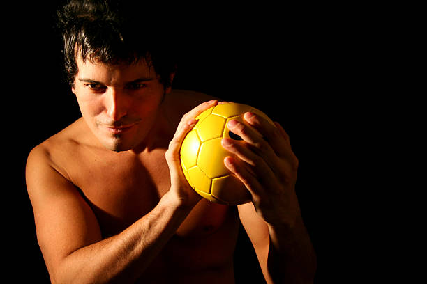 istock Sexy Man with Yellow Ball 182167107