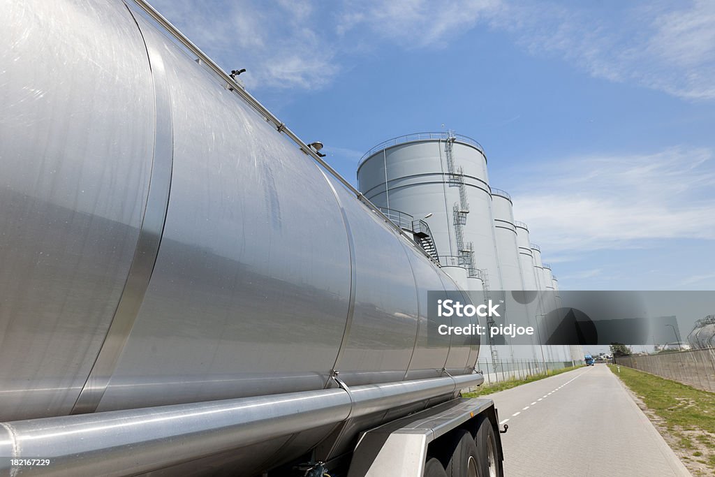 truck parked in front of storage tanks XXXL image wide angle view on a trailer parked in front of a row of white storage tanks near the port of Rotterdam The Netherlands Truck Stock Photo