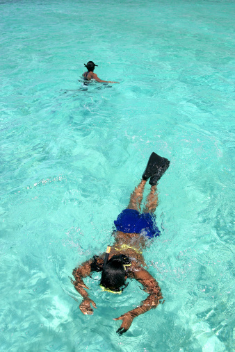 Picture of a woman snorkeling.