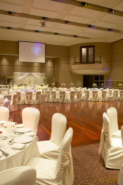 Wide view of the tables at the wedding hall dinner party