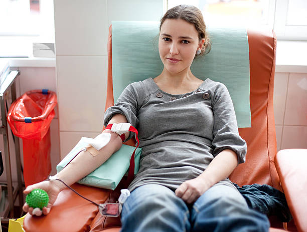 blood donation - female - kan bağışı stok fotoğraflar ve resimler