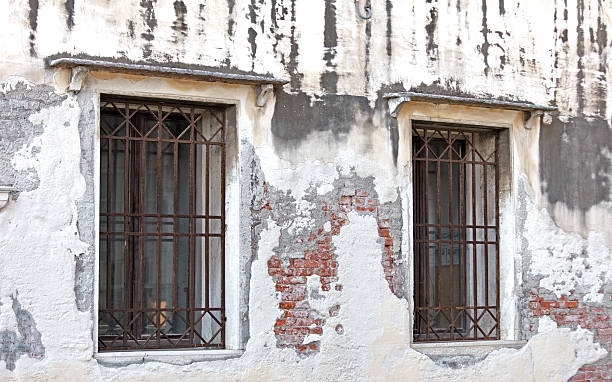 istock Weathered wall witn window in Venice, Italy 182167651