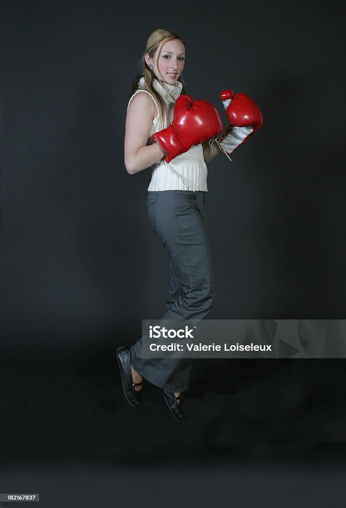 Boxing and jumping Boxing and jumping on black background. Adult Stock Photo