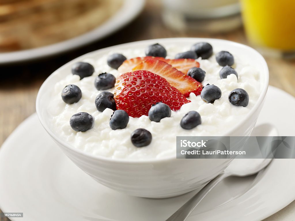 Cottage Cheese with Fresh Fruit "Cottage Cheese with Fresh Strawberry's and Blueberry's, Orange Juice, Milk and Whole Wheat Toast- Photographed on Hasselblad H3D2-39mb Camera" Cottage Cheese Stock Photo