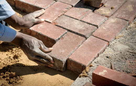 bricklayer at work at new house in construction
