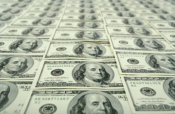 $100 bills background Lot's of $100 banknotes. Can be used as a background for your projects. High resolution - 16 Mpx. sales win stock pictures, royalty-free photos & images