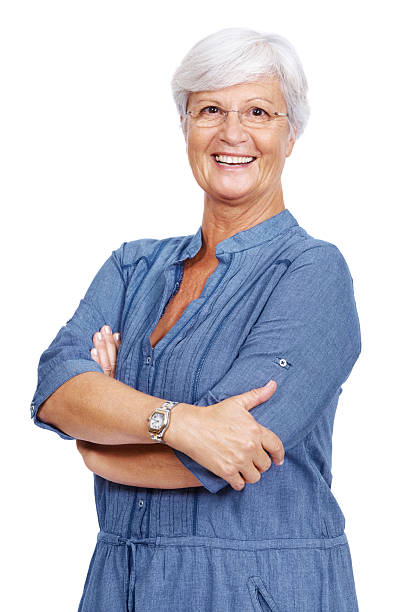 istock Smiling old female standing with arms crossed 182169729