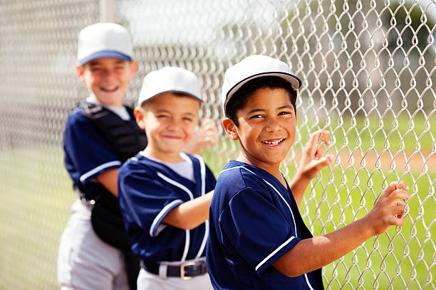 Baseball Players Members of a little league baseball team. youth baseball and softball league photos stock pictures, royalty-free photos & images