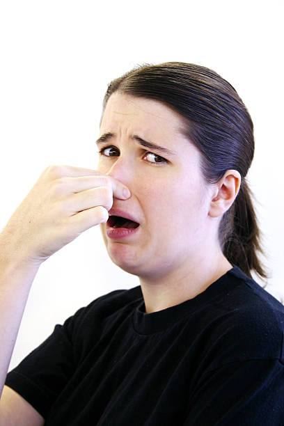 это stinks! - human nose smelling scented unpleasant smell стоковые фото и и�зображения