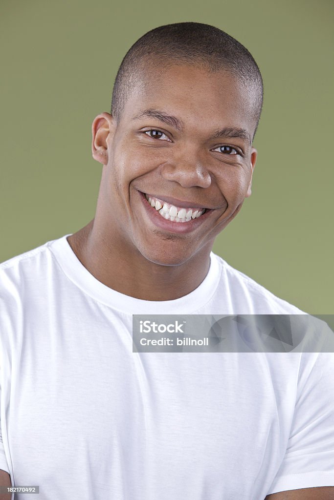 Portrait of man smiling and looking at camera Please view more blank shirt photos here: 20-29 Years Stock Photo