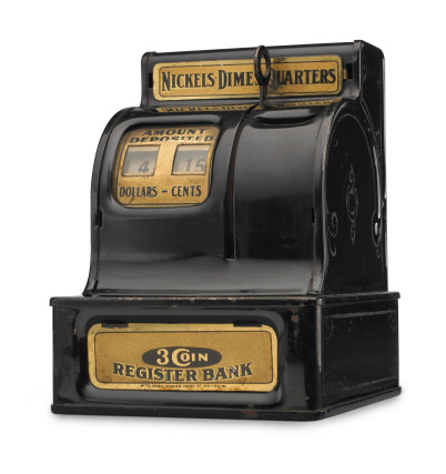 An antique coin bank from the 1930s isolated on a white background. Image has a small dropped shadow and a clipping path which can be used to delete the shadow if desired.