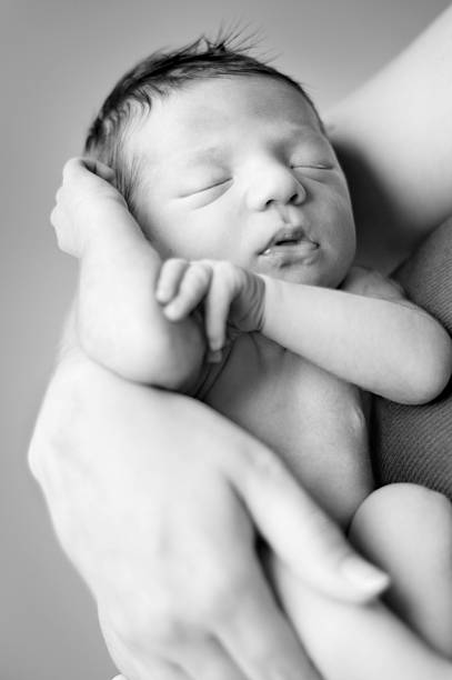 istock Newborn Baby Boy in Mama's Arms 182171443