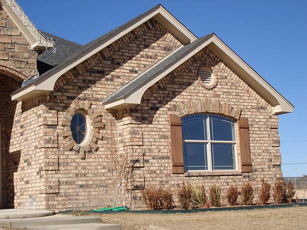 istock brick and stone oval and arch house 182171538