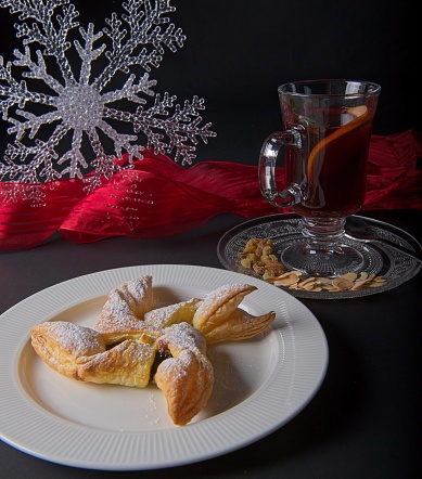 Traditional Finish style Christmas star dessert served with mulled wine (Glögi).