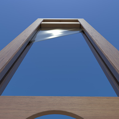 Looking up at a guillotine blade set against a blue sky. Very high resolution 3D render.
