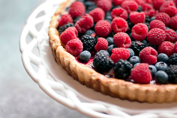 A raspberry and blackberry tart stock photo