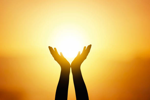 istock silhouette of man both hands and sunset light 1821717855
