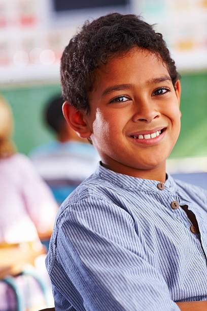 istock Portrait of a cute schoolboy smiling 182171861