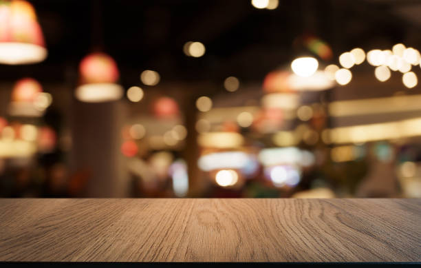 istock Mock up for space. Empty dark wooden table in front of abstract blurred bokeh background of restaurant . can be used for display or montage your product 1821734685