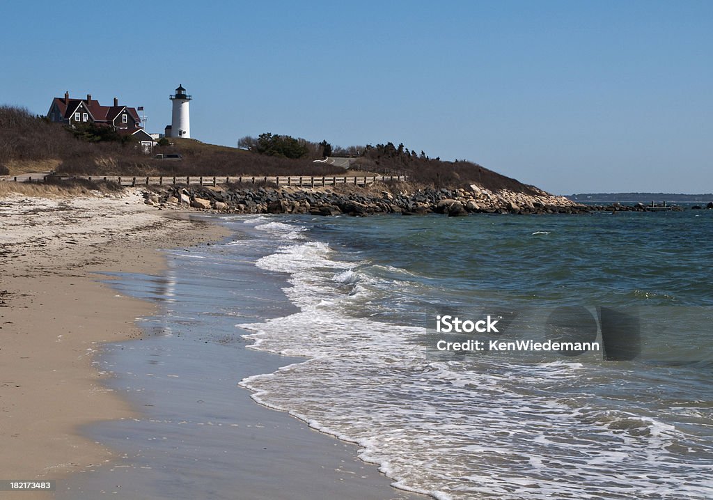 Gentle Waves at Lighthouse Beach "Gentle waves wash on the sand beach below Nobsca Lighthouse in Woods Hole, Massachusetts" Beach Stock Photo