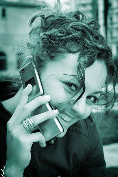 istock Smiling girl on mobile 182173556