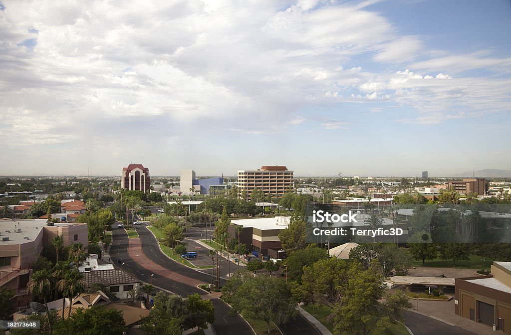Urban Mesa Arizona Aerial View of City Skyline View from top floor of a high rise in Mesa Arizona. Looking southeast. Mesa Arts Center is modern blue building in center.  Panaorama view: Mesa - Arizona Stock Photo