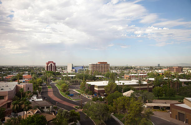 Urban Mesa Arizona Aerial View of City Skyline View from top floor of a high rise in Mesa Arizona. Looking southeast. Mesa Arts Center is modern blue building in center.  Panaorama view: mesa arizona stock pictures, royalty-free photos & images