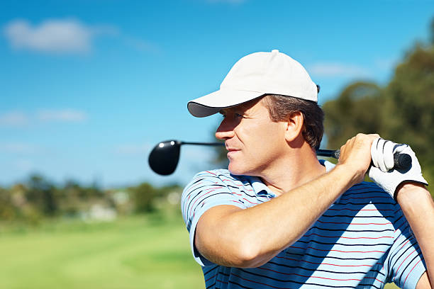 istock Golfer during the follow through of his swing 182173688