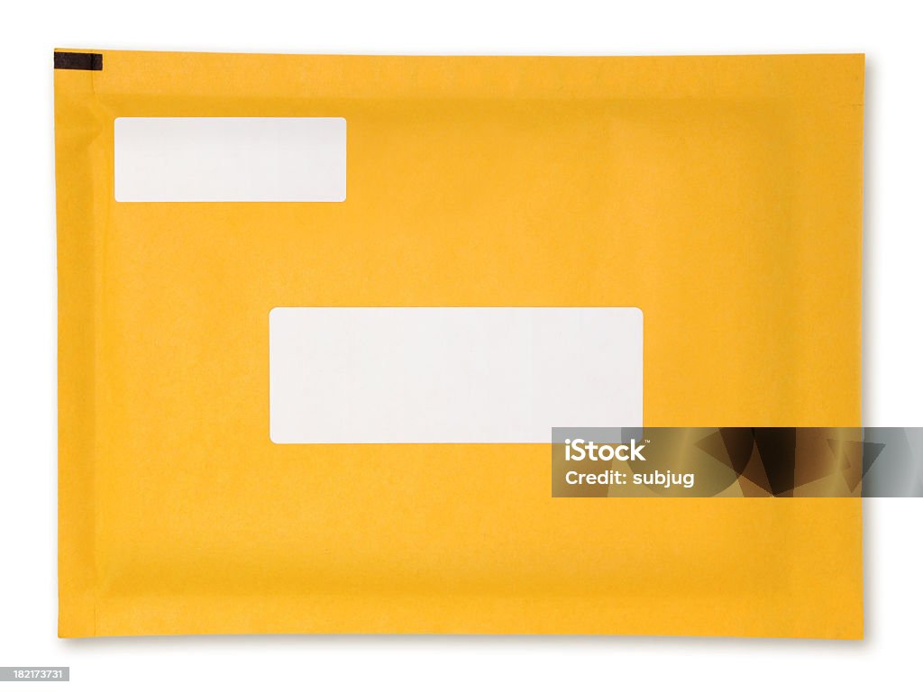 Yellow padded envelope with blank white labels Shipping envelope with blank address labels Envelope Stock Photo