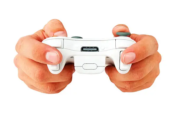 Wireless game controller being played by a man, isolated on white