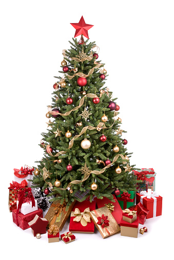 Christmas tree decorated with traditional Christmas decorations, illuminated by Christmas lights that flash with a play of shadows and lights wishing you a Merry Christmas. The snow-covered pine branches with decorated Christmas balls, in the foreground gifts wrapped with gift papers.