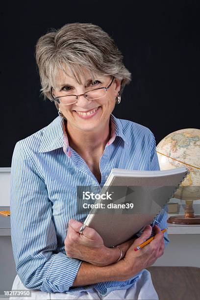 Teacher In A Classroom Stock Photo - Download Image Now - Chalkboard - Visual Aid, Teacher, Back to School