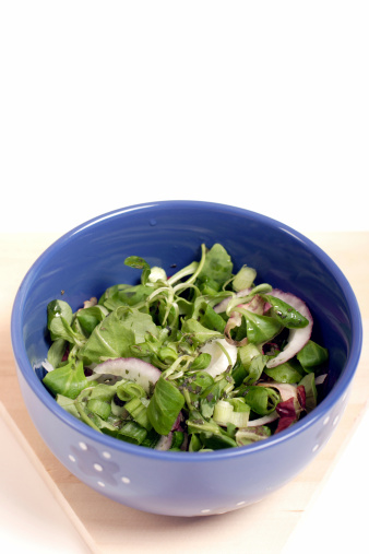 Mixed salad in blue bowl
