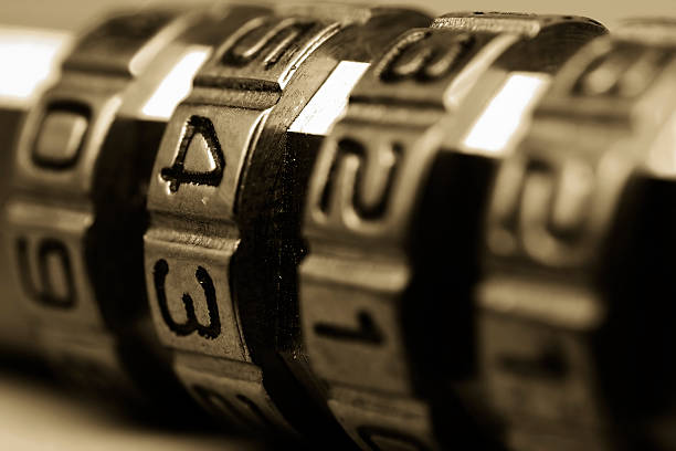 Combination lock Shallow DOF, focus is on the center ring combination lock stock pictures, royalty-free photos & images