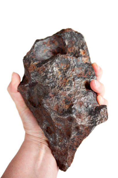 Hand Holding Iron Canyon Diablo Meteorite, with Rust stock photo