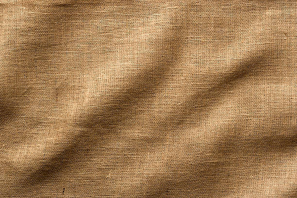 Burlap Fabric with Wrinkles, Wide Shot. Full Frame. Wrinkled Burlap fabric - use as a Horizontal or Vertical image, lots of texture and detail. Full Frame. textile stock pictures, royalty-free photos & images