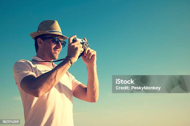 Retro Tourist Photographer Taking A Photo In Vintage Scene Stock Photo - Download Image Now